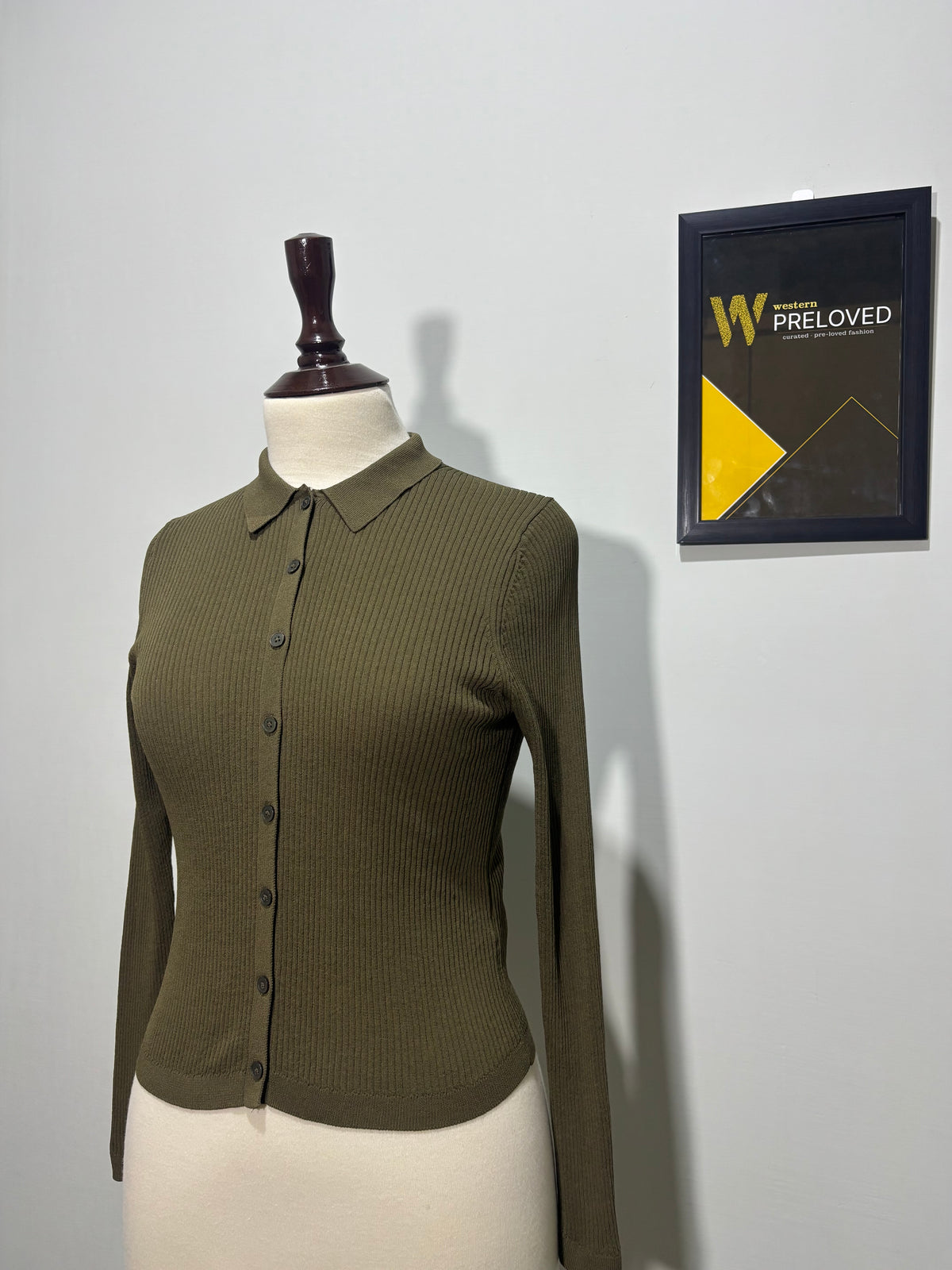 Olive green textured long-sleeve cardigan angled view