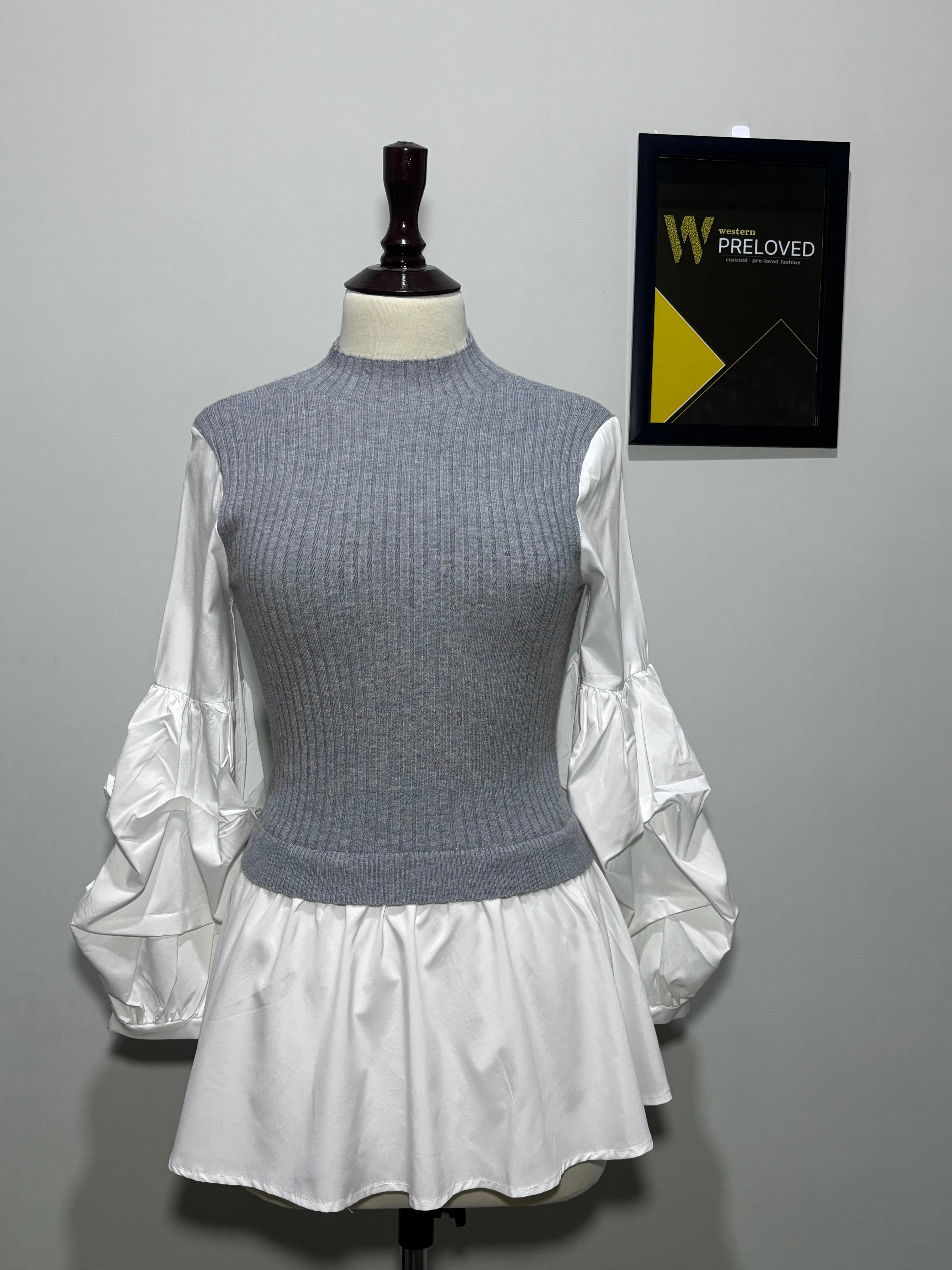 Grey and white layered-look mock-neck peplum top with gathered sleeves