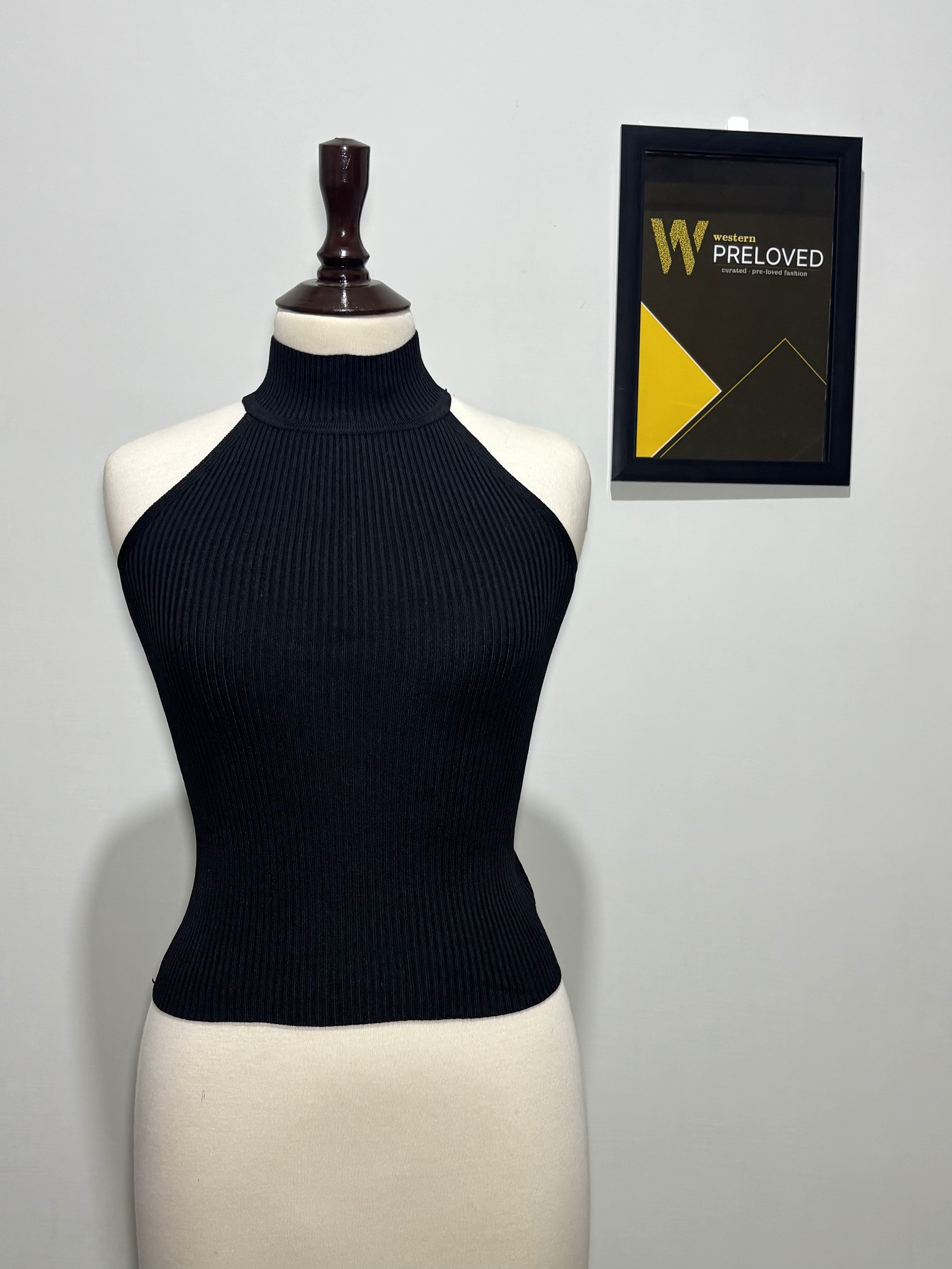Black ribbed high-neck sleeveless top front view