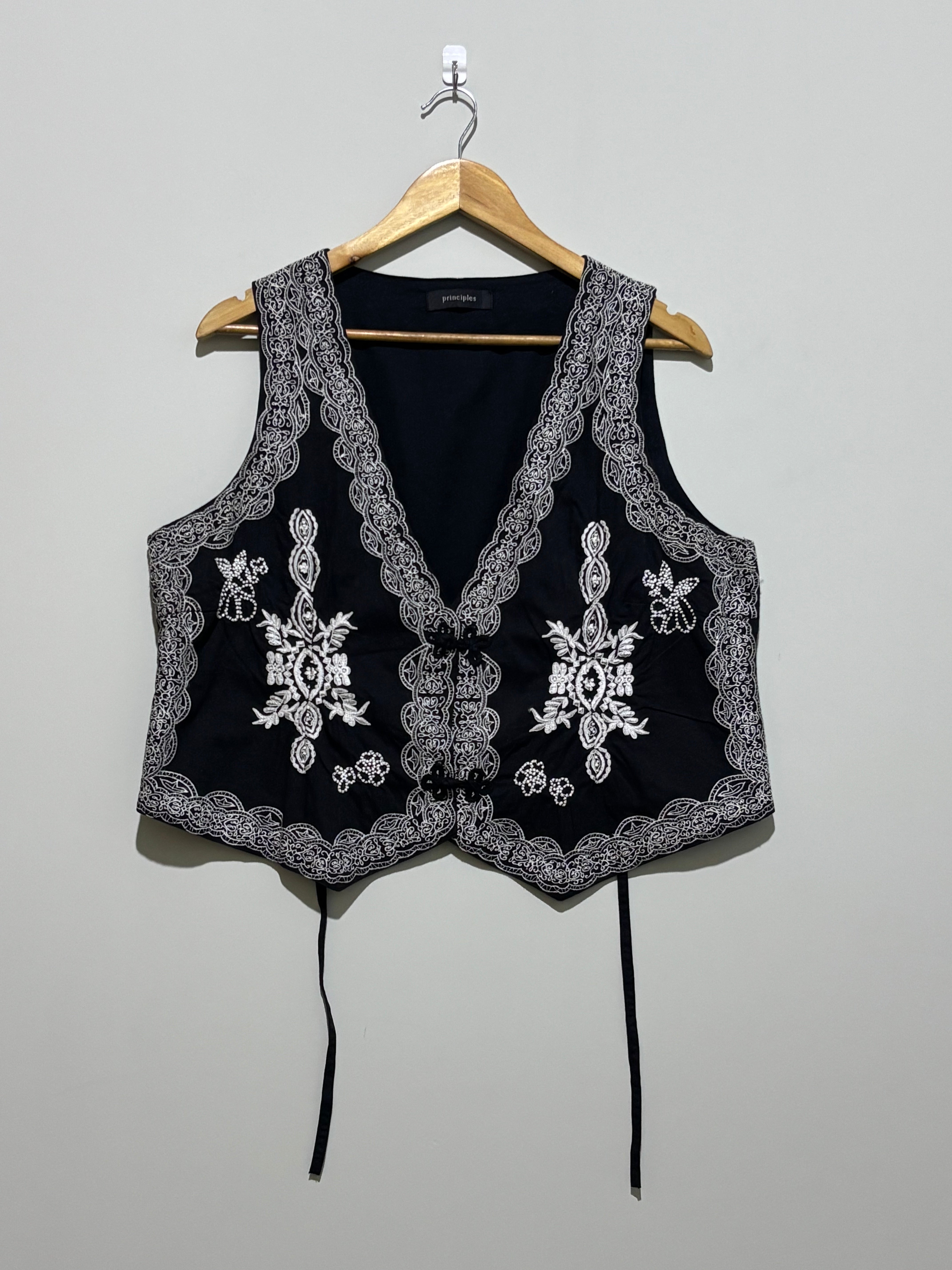 Black waistcoat with contrast floral embroidery and ornate borders
