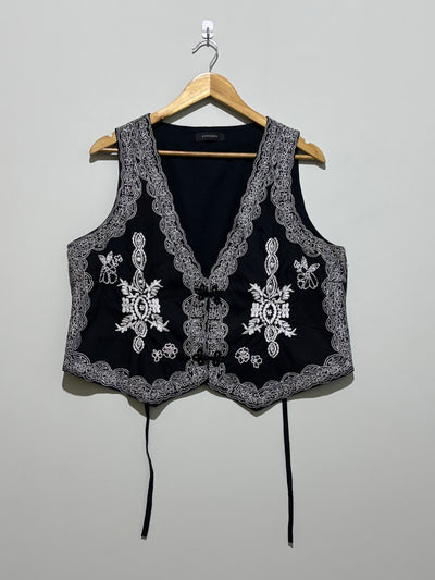 Black waistcoat with contrast floral embroidery and ornate borders