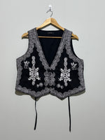 Black waistcoat with contrast floral embroidery and ornate borders