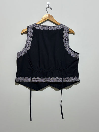 Back of black embroidered waistcoat with waist ties - alternate view