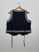 Back of black embroidered waistcoat with waist ties