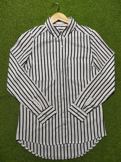Black and white striped shirt on a green background