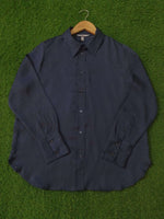 Navy jacket on a green grass background