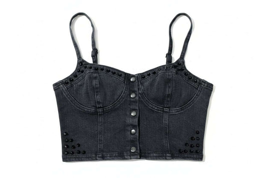 Black denim crop top with button details on a green grass background - alternate view