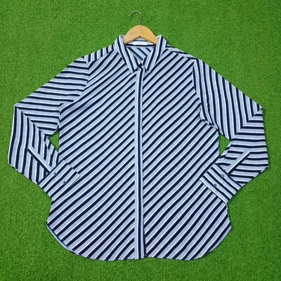 Blue and white striped shirt on a green background