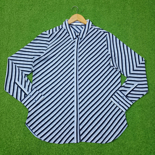 Blue and white striped shirt on a green background