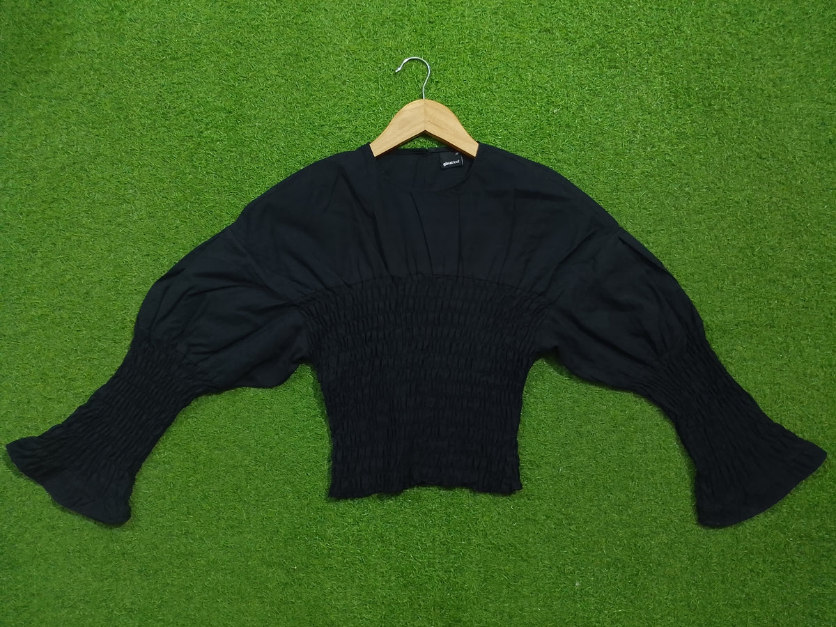 Black smocked drop shoulder flared sleeve crop top - sleeve spread view