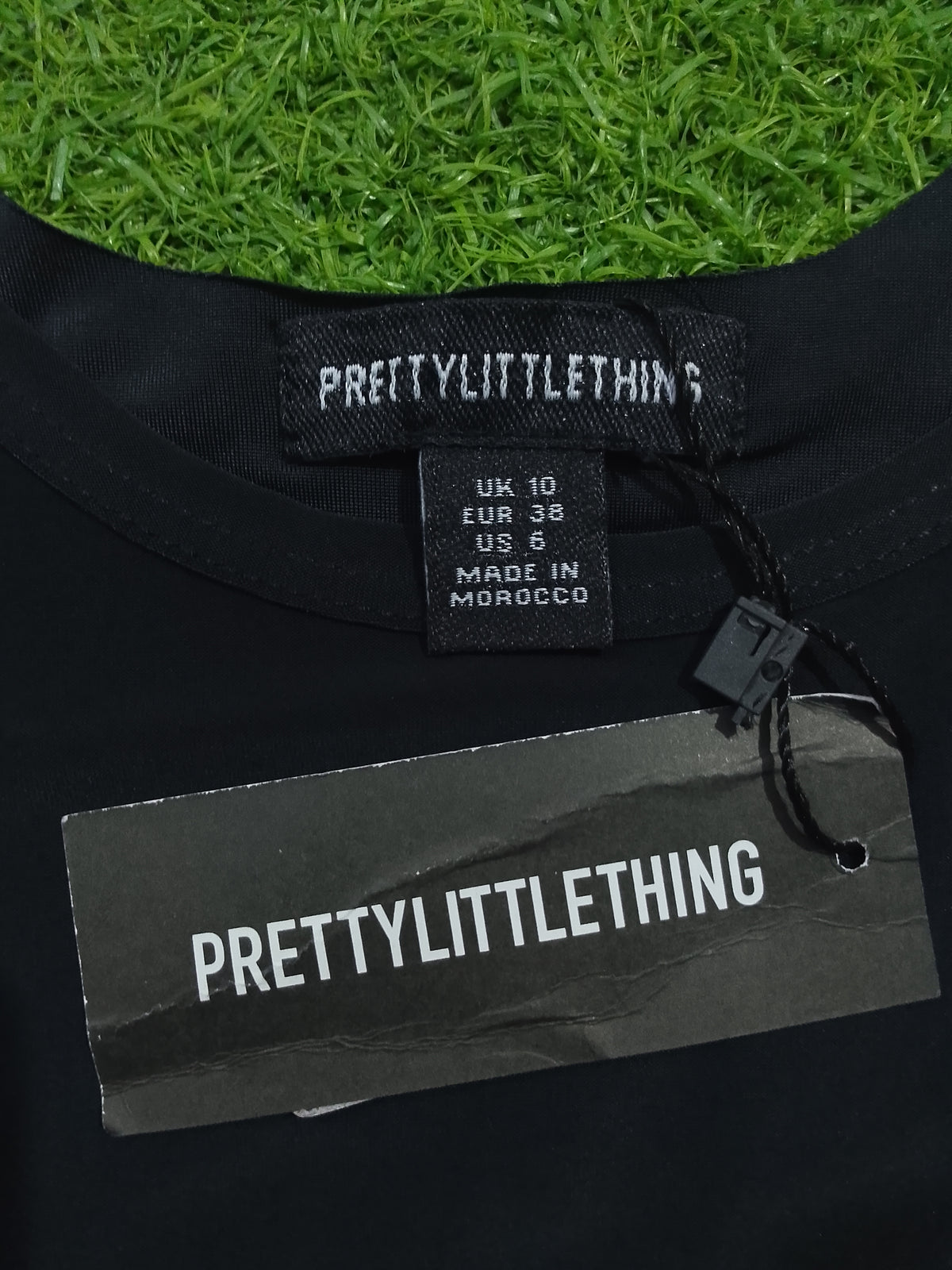 Black sleeveless scoop neck crop top - front view