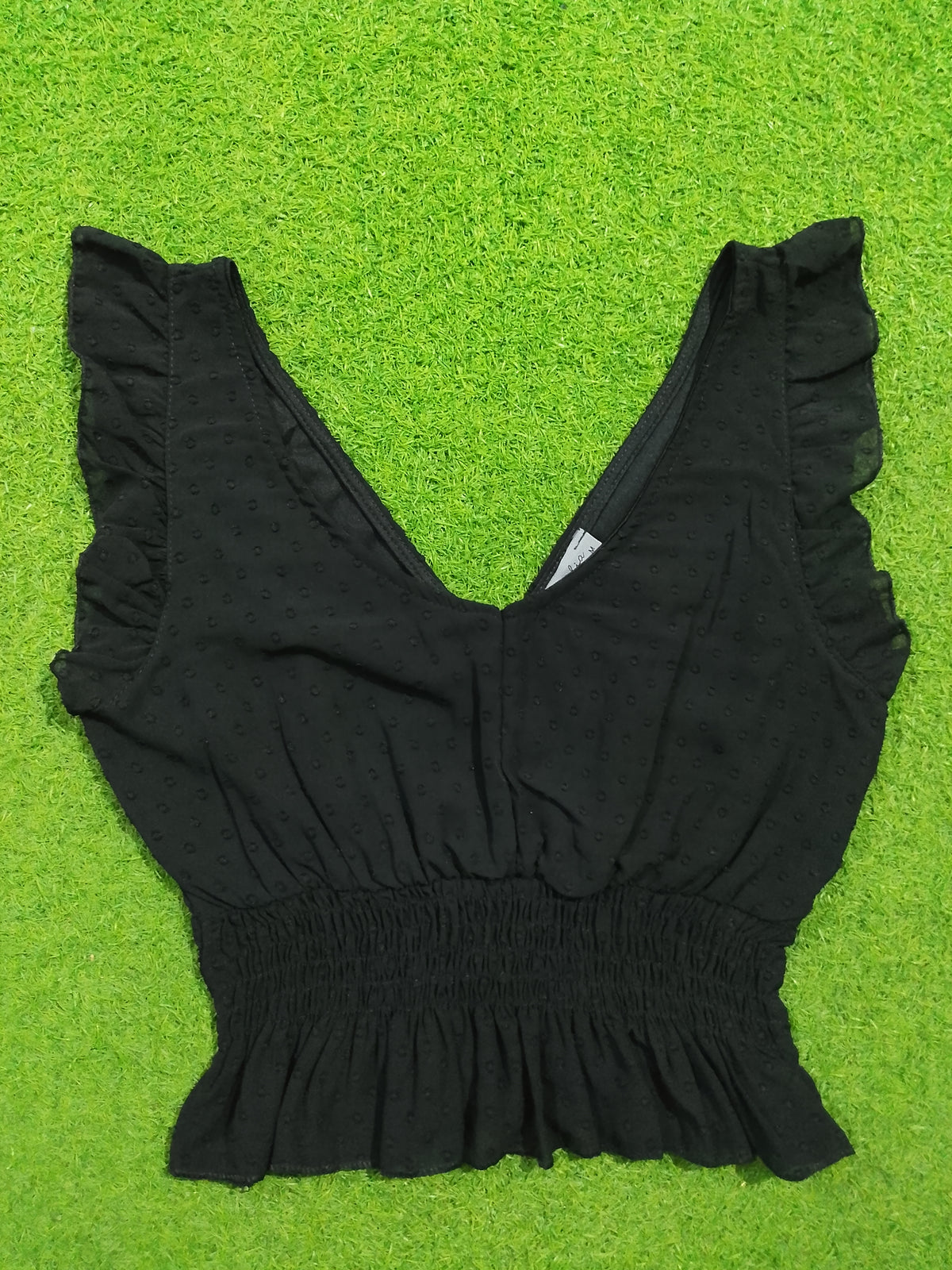 Black V-neck ruffle sleeve smocked waist crop top - detail view