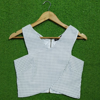 White polka dot V-neck zip front corset crop top - front view