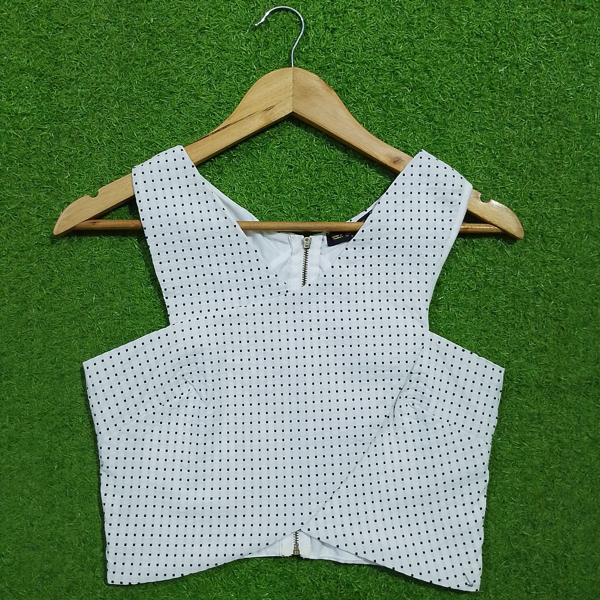 White polka dot V-neck zip front corset crop top - front view