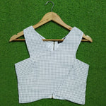 White polka dot V-neck zip front corset crop top - front view
