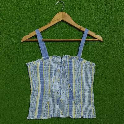 Blue striped smocked lace-up crop top - front view on hanger
