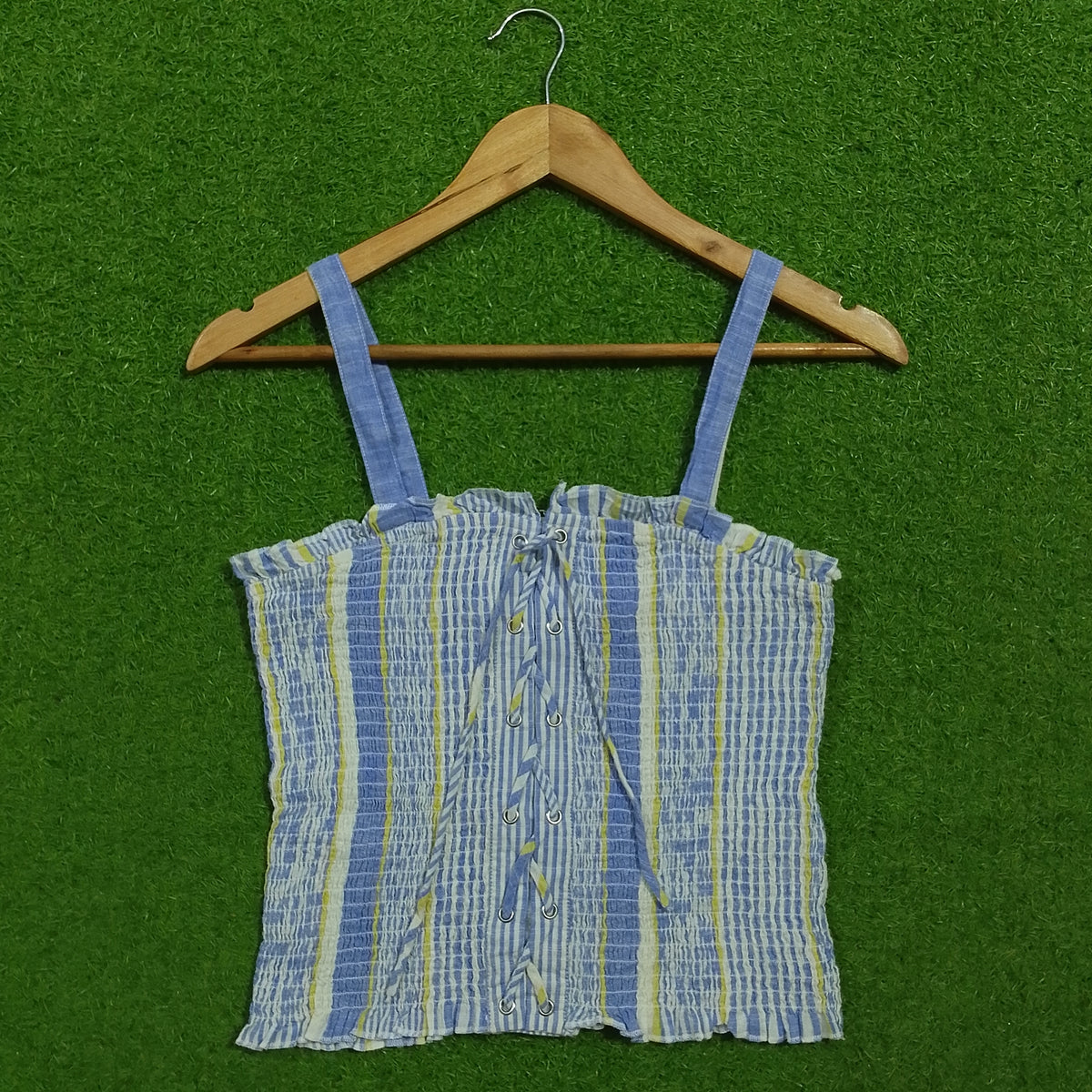 Blue striped smocked lace-up crop top - front view on hanger