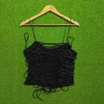 Black string loop detail spaghetti strap crop top - front view on hanger