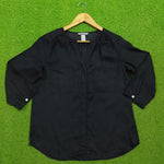 Black 3/4 sleeve V-neck gathered shoulder silk blouse - front view