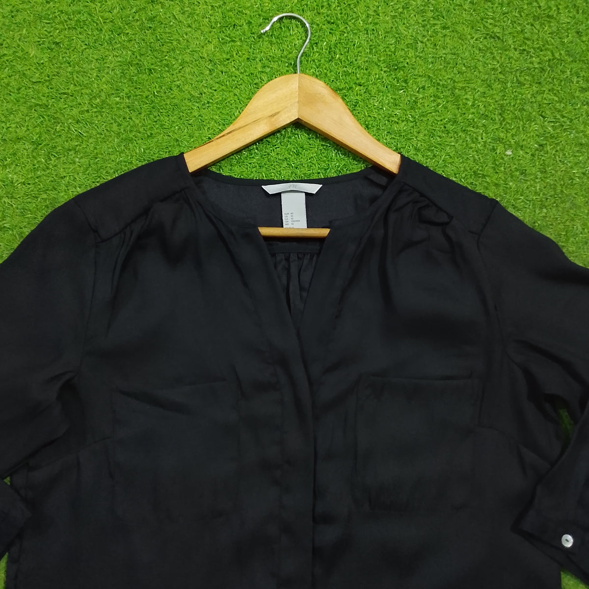 Black 3/4 sleeve V-neck gathered shoulder silk blouse - neckline detail