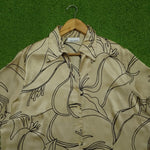 Beige black floral outline print long sleeve shirt collar close-up
