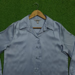 Light blue silk texture long sleeve shirt collar close-up