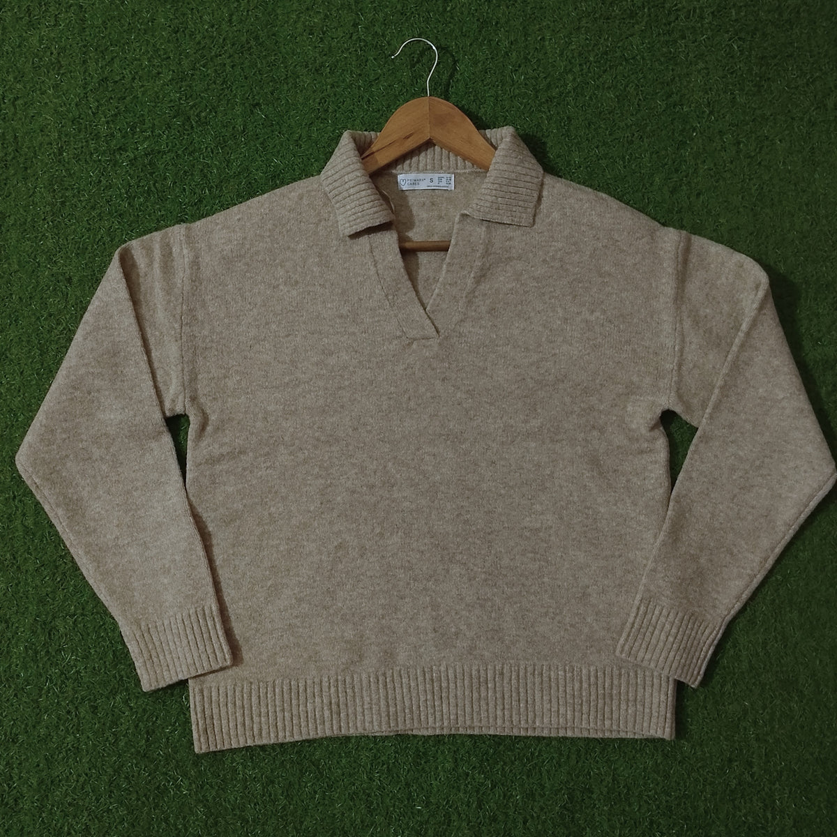 Beige polo collar open V-neck knit sweater - front view