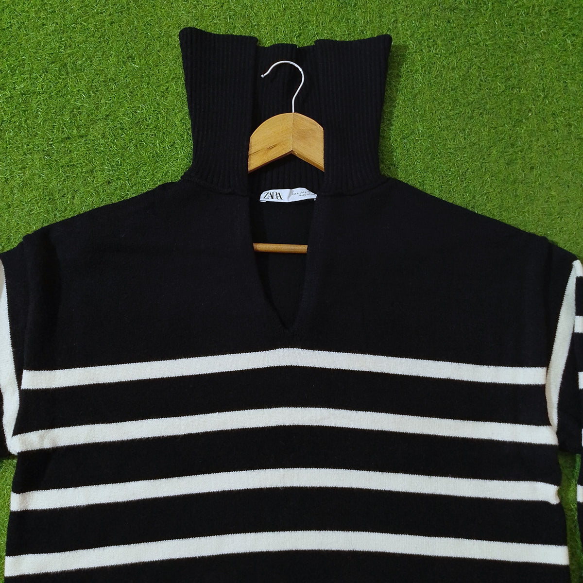 Black and white striped drop shoulder ribbed collar knit blouse - neck detail