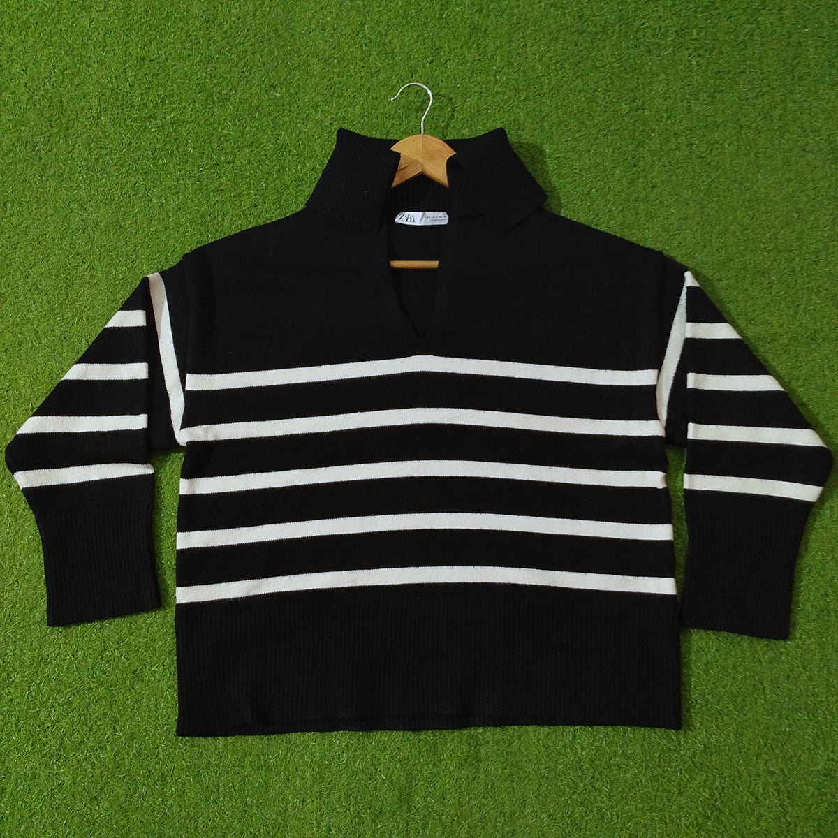 Black and white striped drop shoulder ribbed collar knit blouse - front view