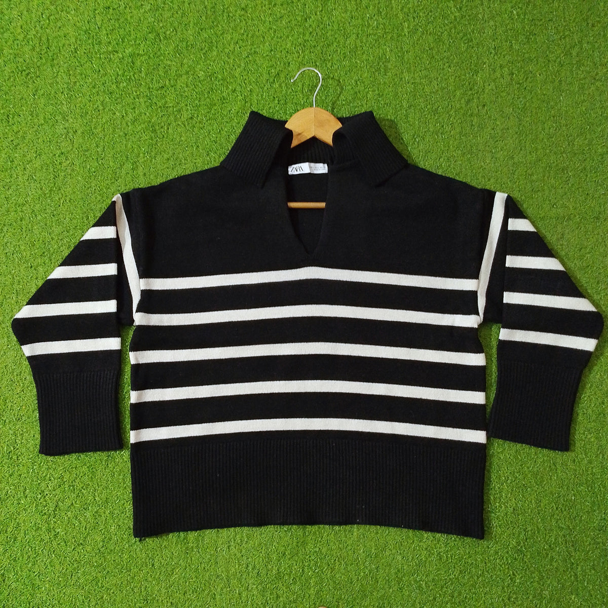 Black and white striped drop shoulder high ribbed collar open V-neck knit blouse - full view