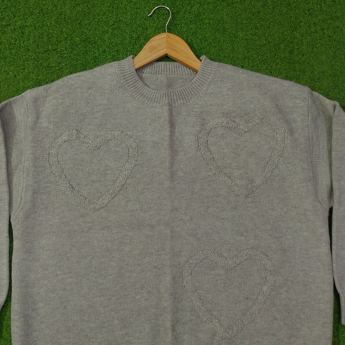 Grey heart embossed crew neck knit sweater - front detail