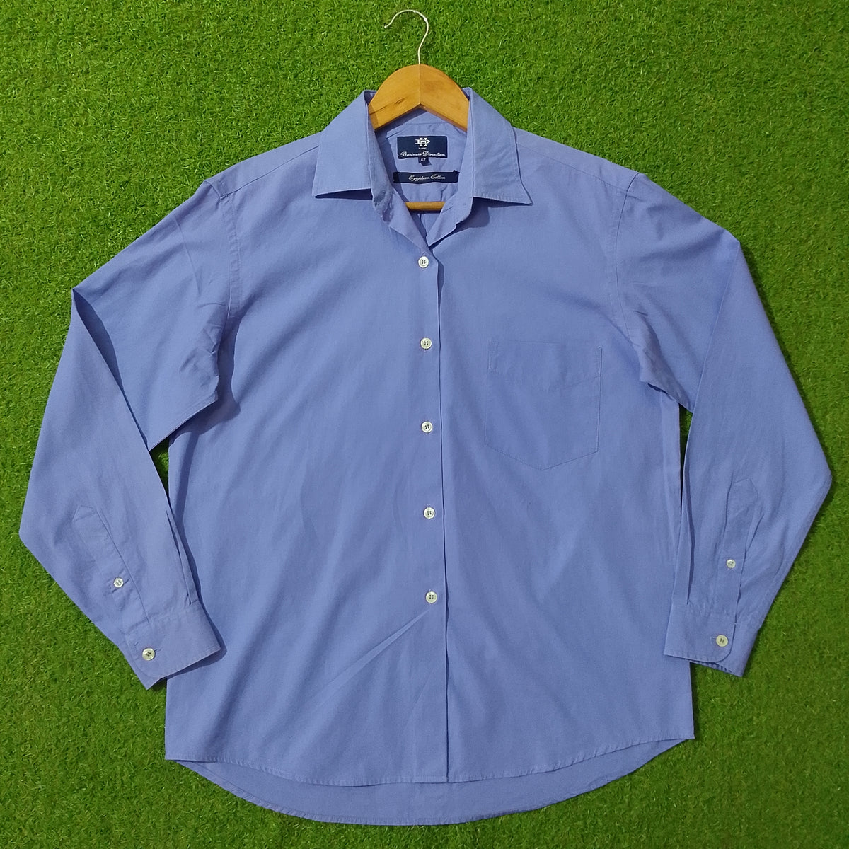 Blue Egyptian cotton button-down shirt by DHE Business Direction - full front view on hanger