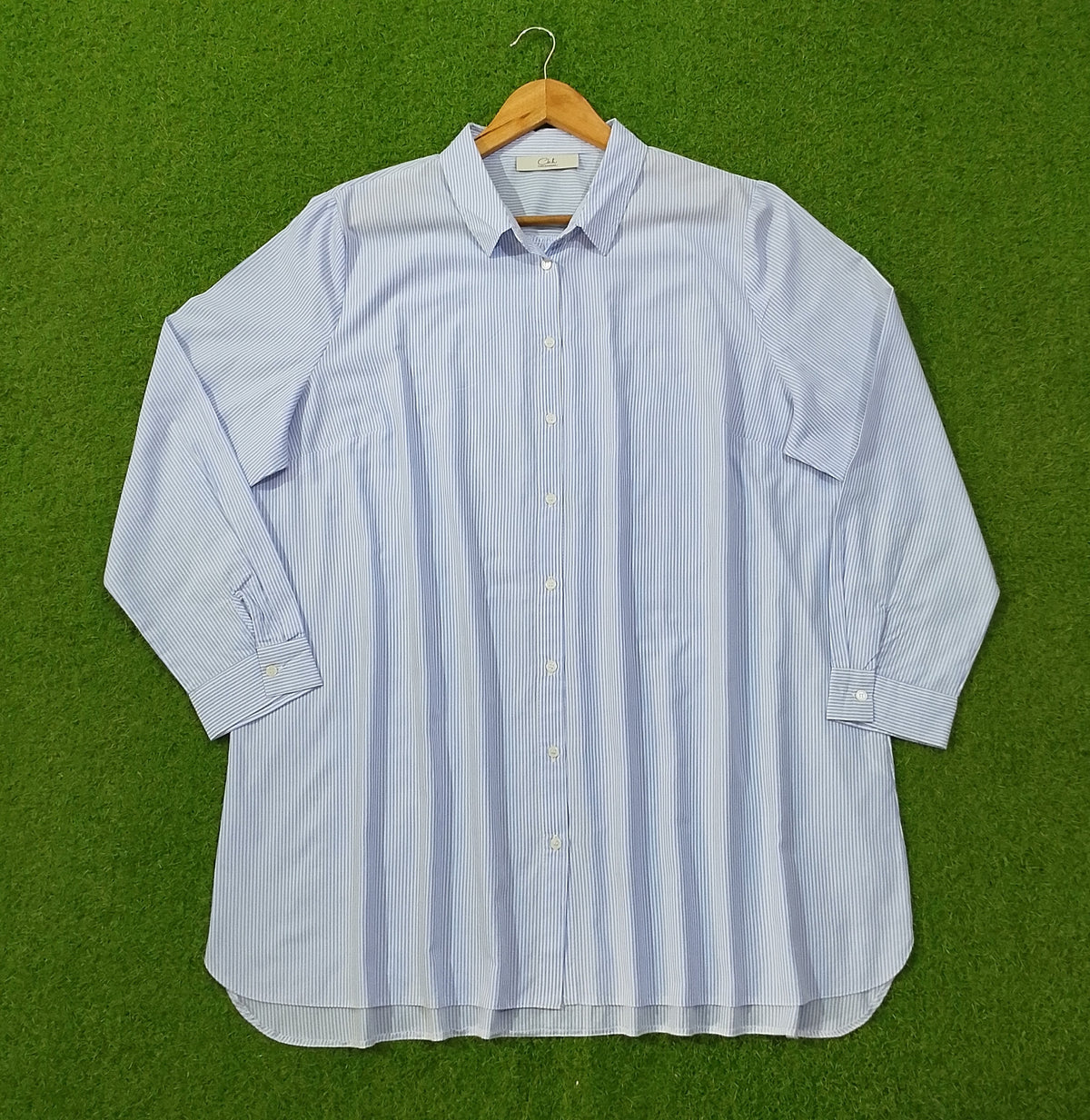 Blue pinstripe oversized button-down cotton shirt by CKH - full front view on hanger