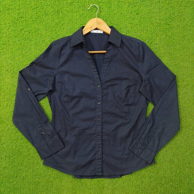 Navy blue polka dot cotton shirt by Mango - front view on hanger
