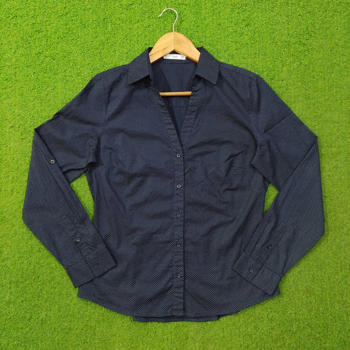 Navy blue polka dot cotton shirt by Mango - front view on hanger