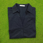 Navy blue polka dot cotton shirt by Mango - folded view