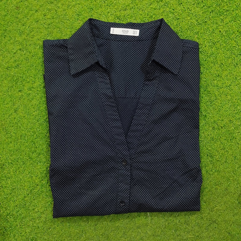 Navy blue polka dot cotton shirt by Mango - folded view