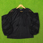 Black crochet lace puff sleeve cotton top by Ibana - full front view on hanger