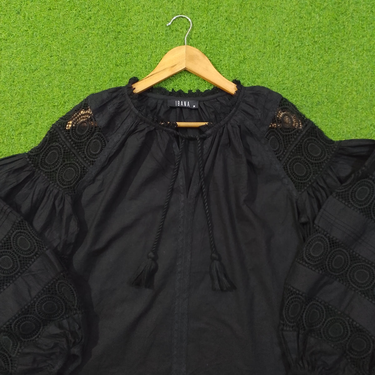 Black crochet lace puff sleeve cotton top by Ibana - neckline and label close up