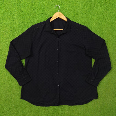 Black eyelet cotton oversized shirt - full front view on hanger