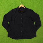 Black eyelet cotton oversized shirt - full front view on hanger