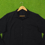 Black eyelet cotton oversized shirt - collar and upper body close up