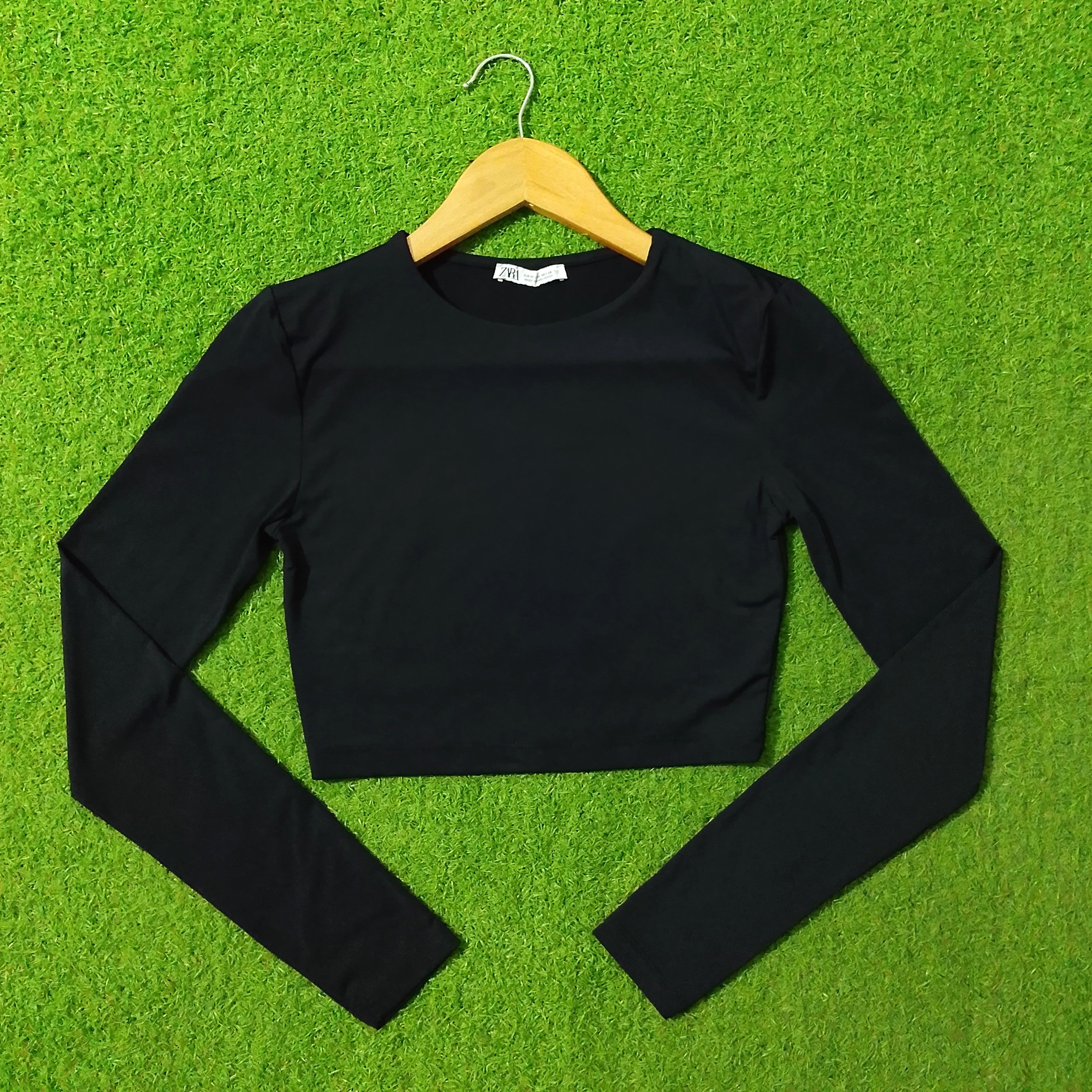 Black long sleeve crop top front view