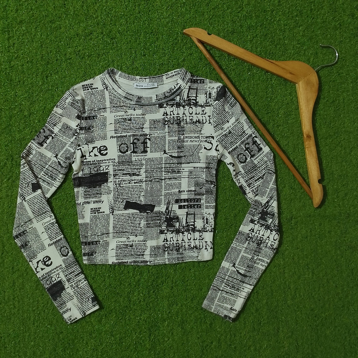 Newspaper print long sleeve crop top full view