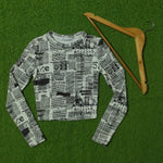 Newspaper print long sleeve crop top full view