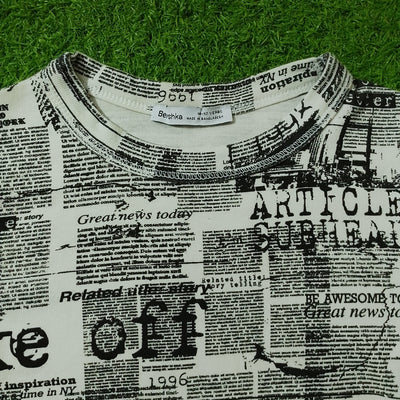Newspaper print crop top Beishka label close-up - alternate view