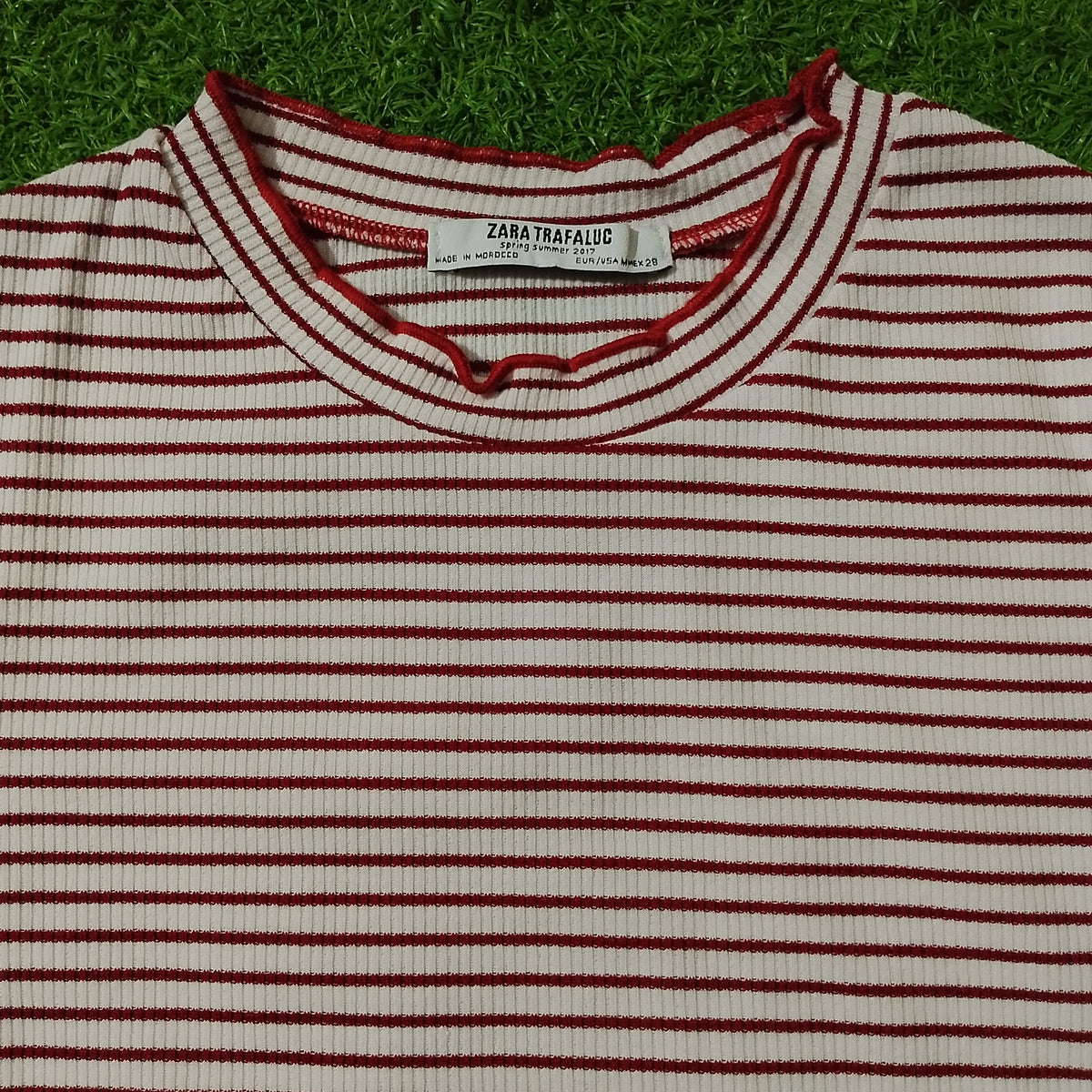 Zara Trafaluc label close-up on striped crop top