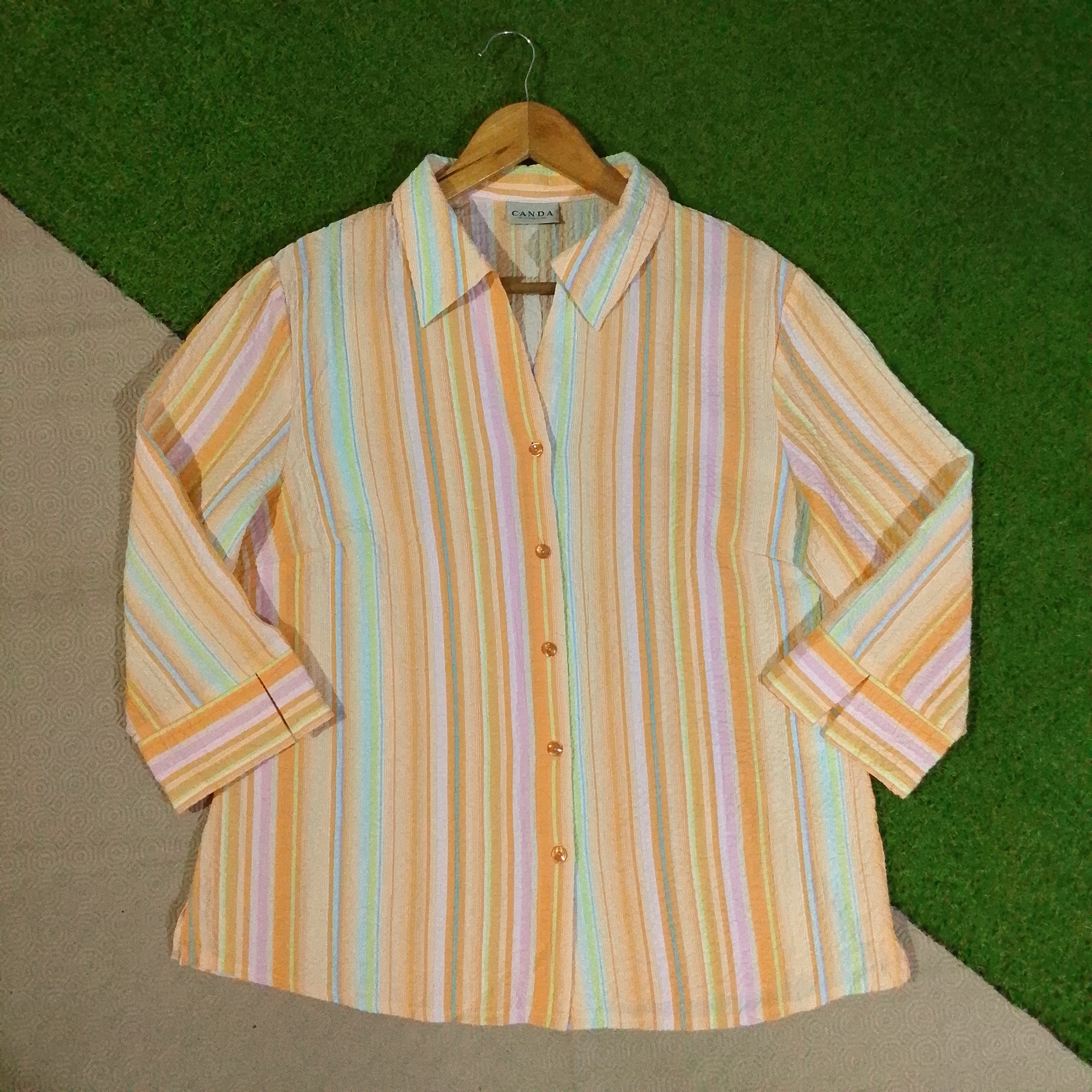 Pastel striped women's shirt front detail