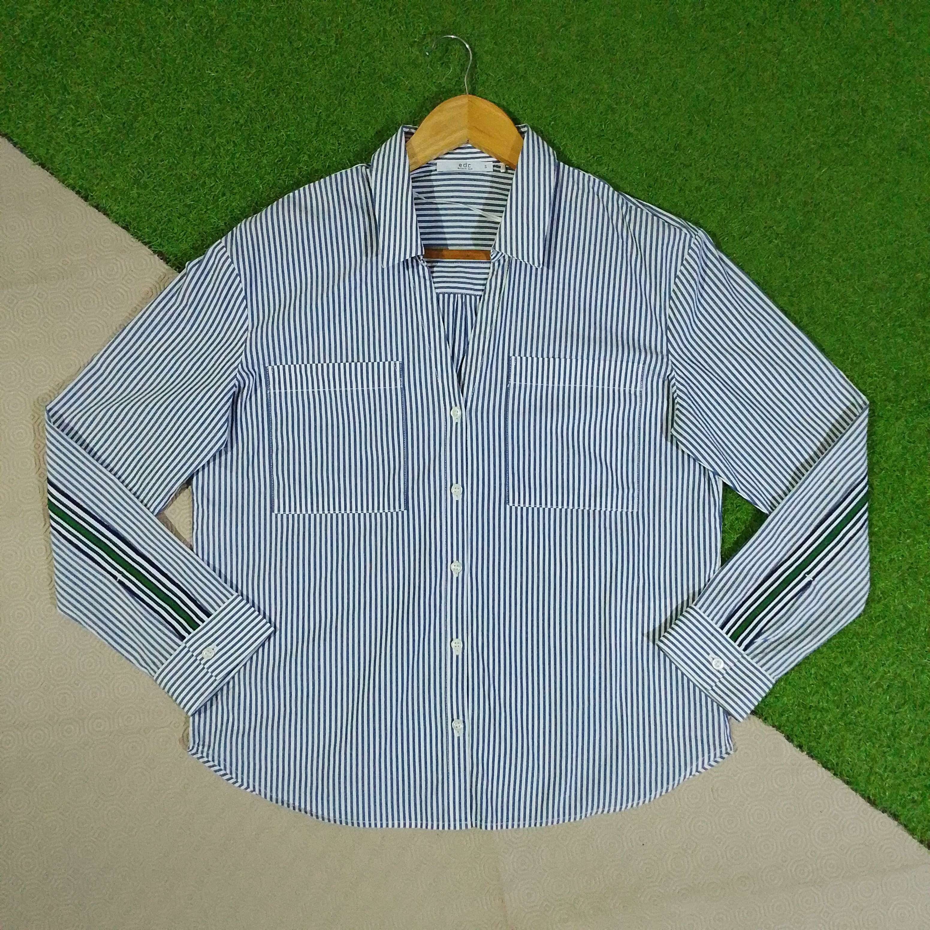 Blue and white striped button-down shirt front view
