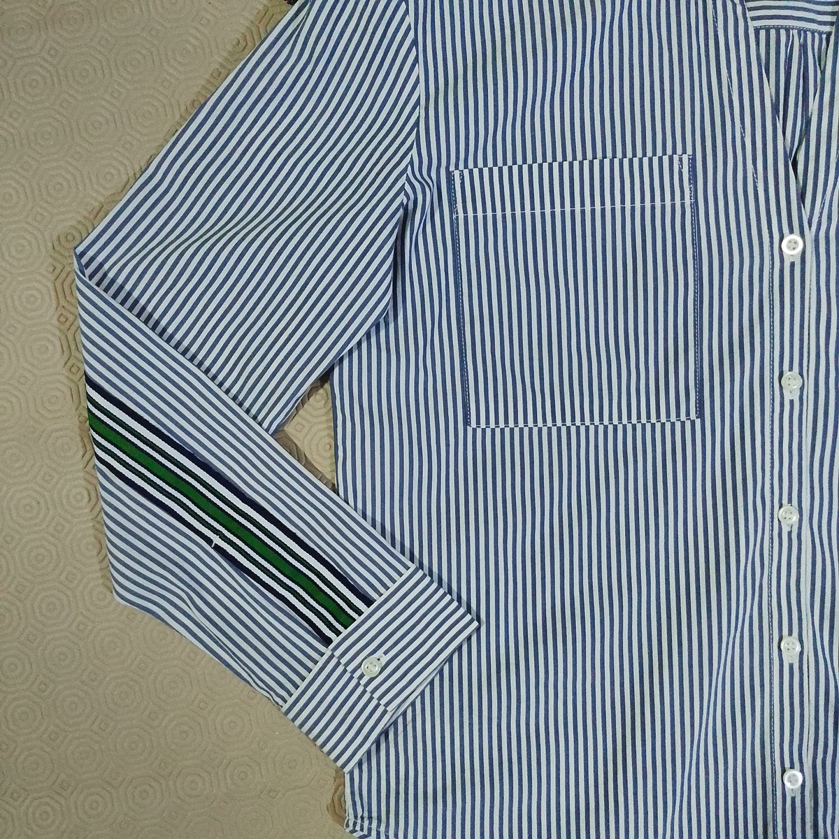 Blue and white striped shirt sleeve detail